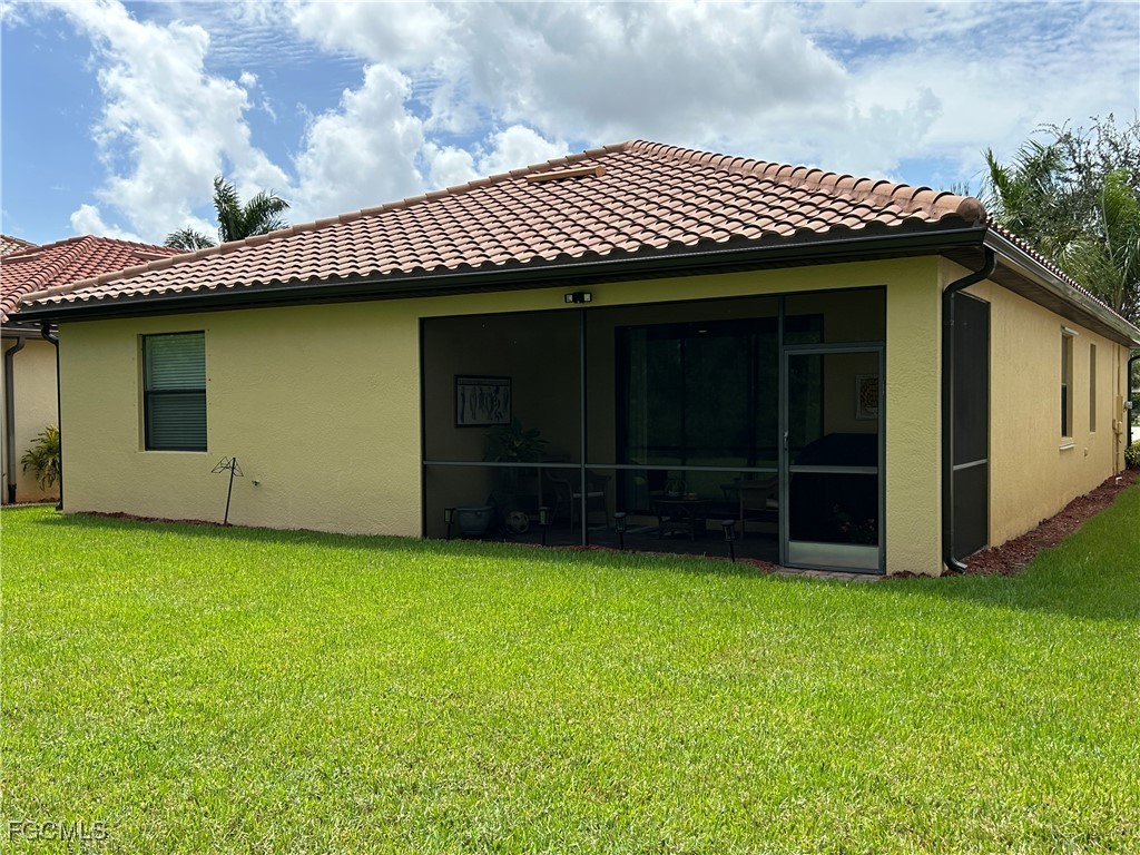 8963 Water Tupelo Road Fort Myers, FL 33912 - Photo 6 of 37 a view of a house with a garden