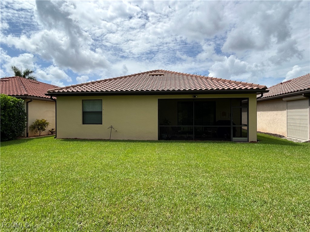 8963 Water Tupelo Road Fort Myers, FL 33912 - Photo 7 of 37 a house with a garden