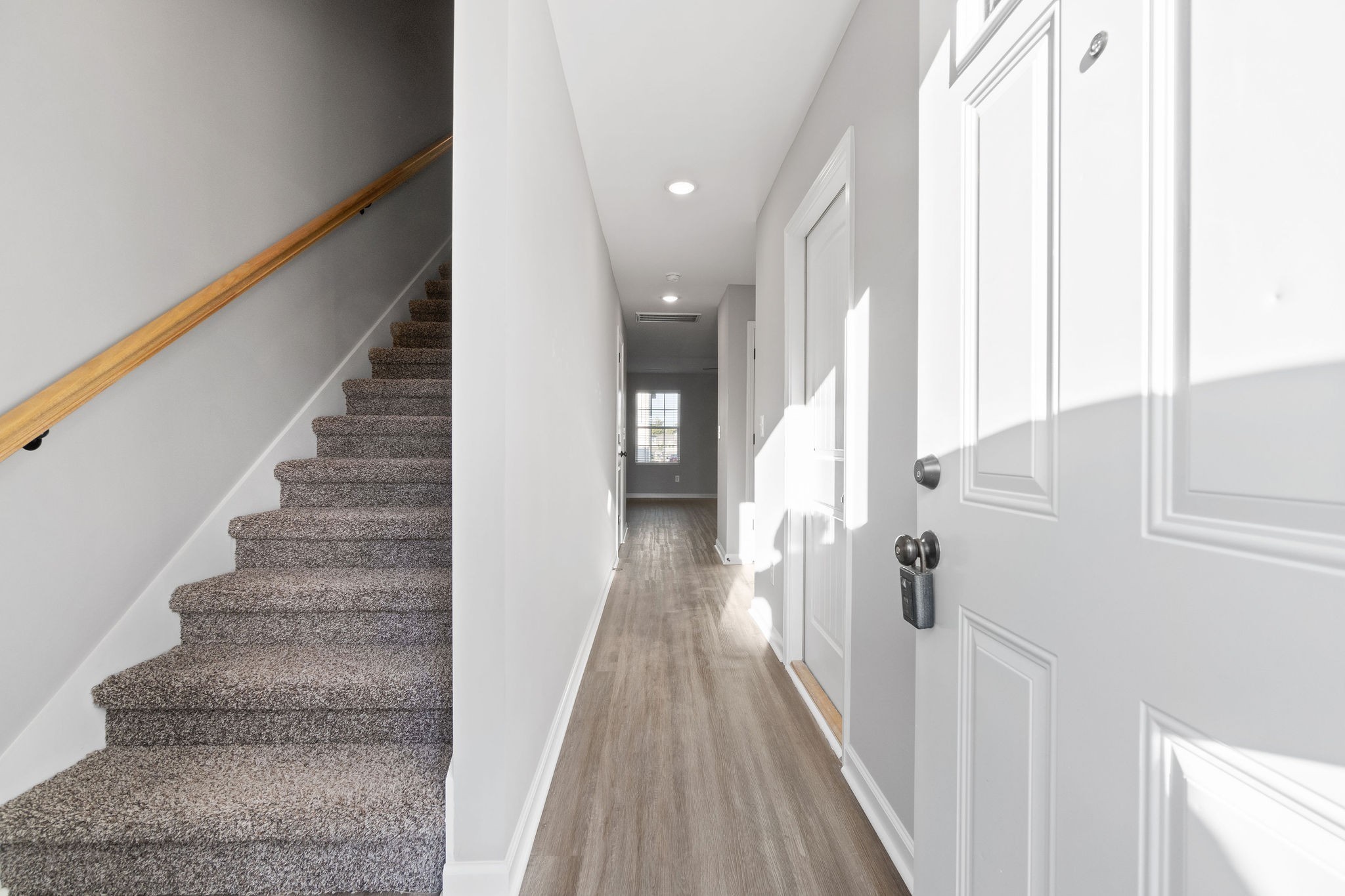 2186 Peachers Mill Road, Unit A7 Clarksville, TN 37042 - Photo 2 of 15 a view of a hallway with wooden floor and staircase