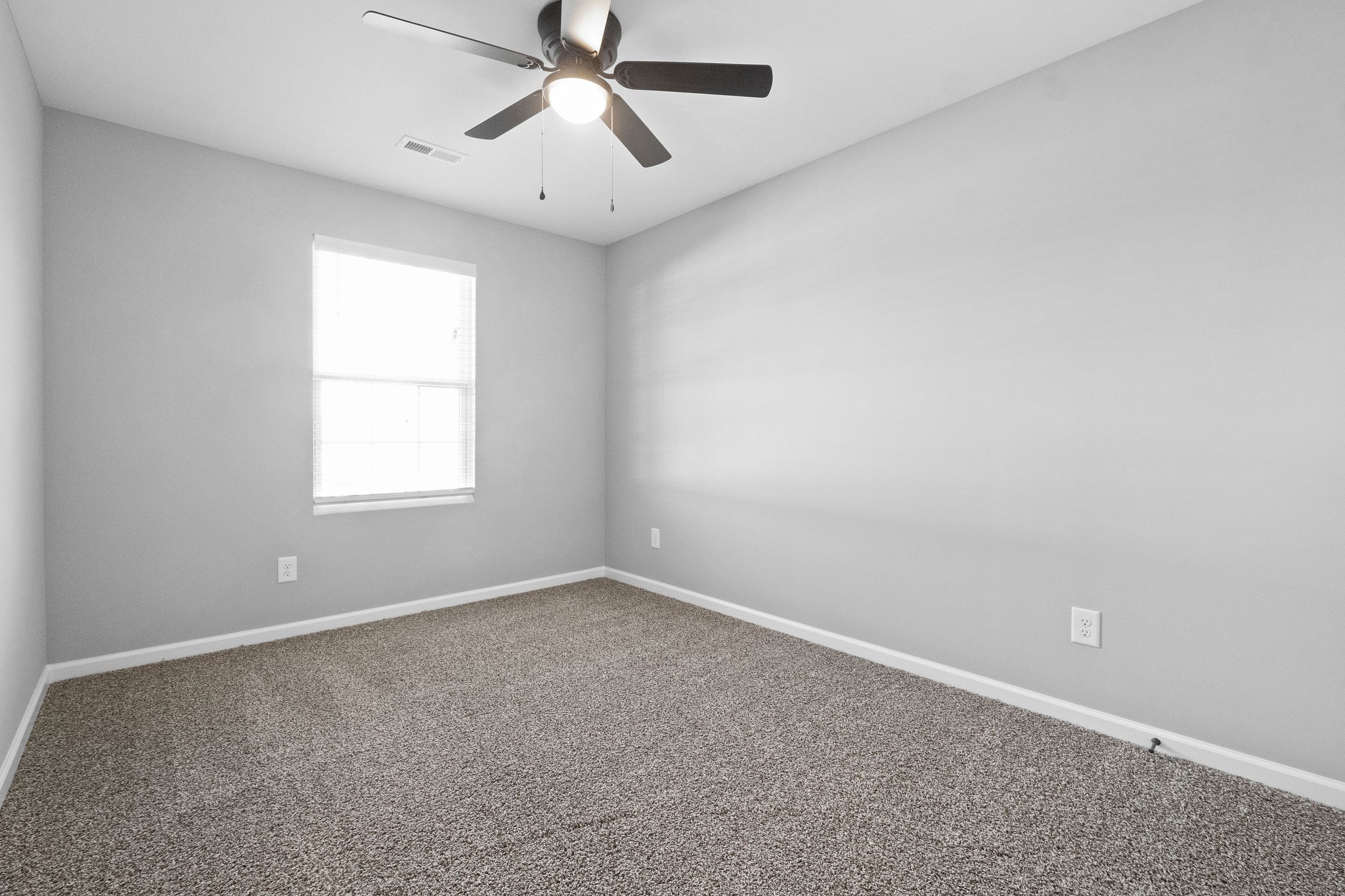 2186 Peachers Mill Road, Unit A7 Clarksville, TN 37042 - Photo 10 of 15 an empty room with a window and a fan