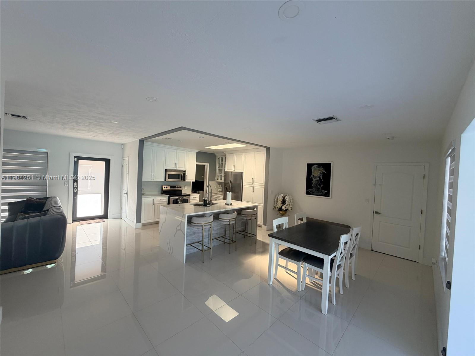 8721 Southwest 191st Street Cutler Bay, FL 33157 - Photo 6 of 15 a living room with furniture and a large window