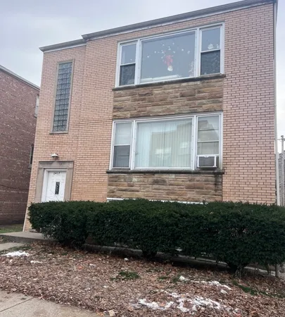 a view of house with backyard