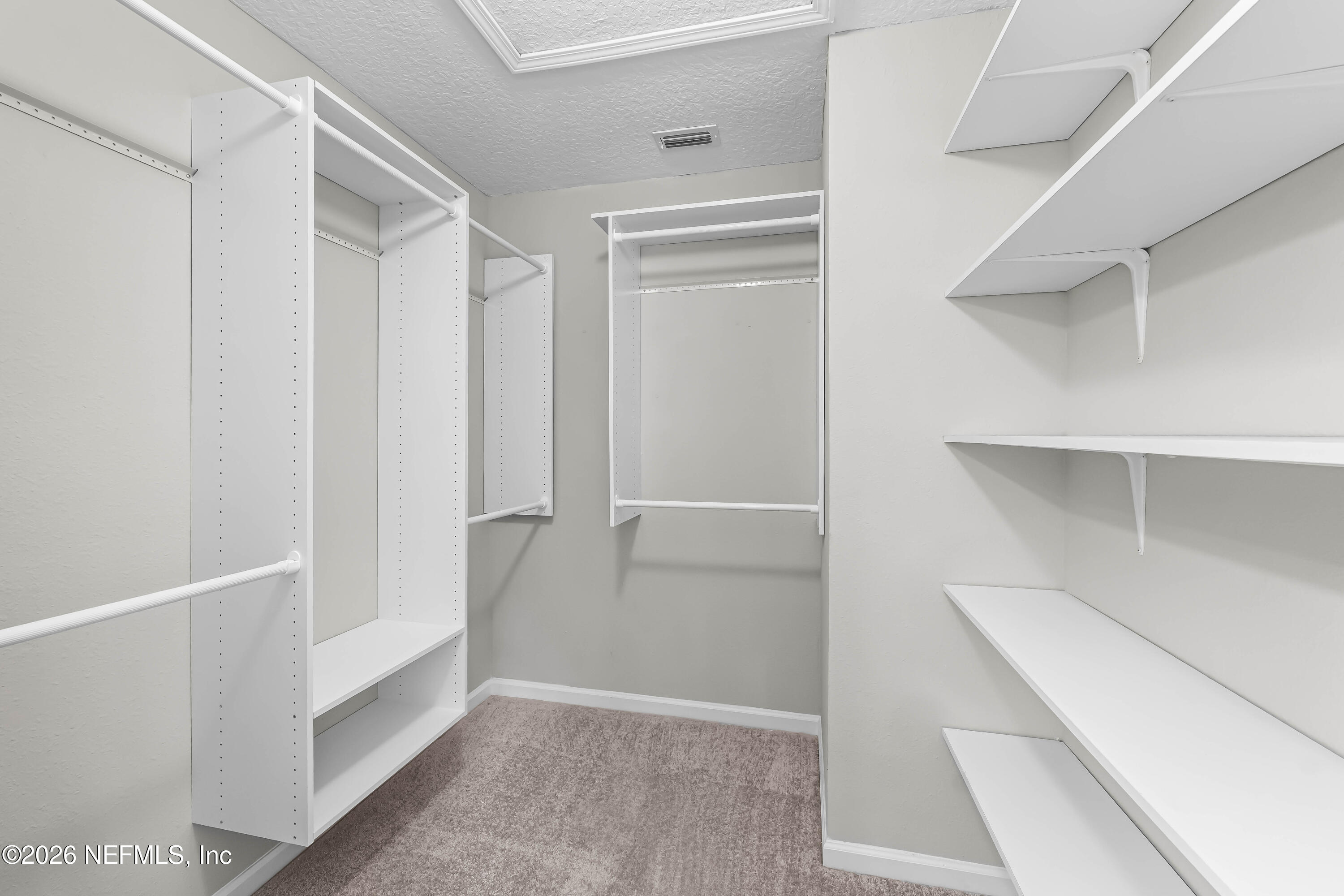 65704 Edgewater Drive Yulee, FL 32097 - Photo 18 of 35 Walk-In Closet