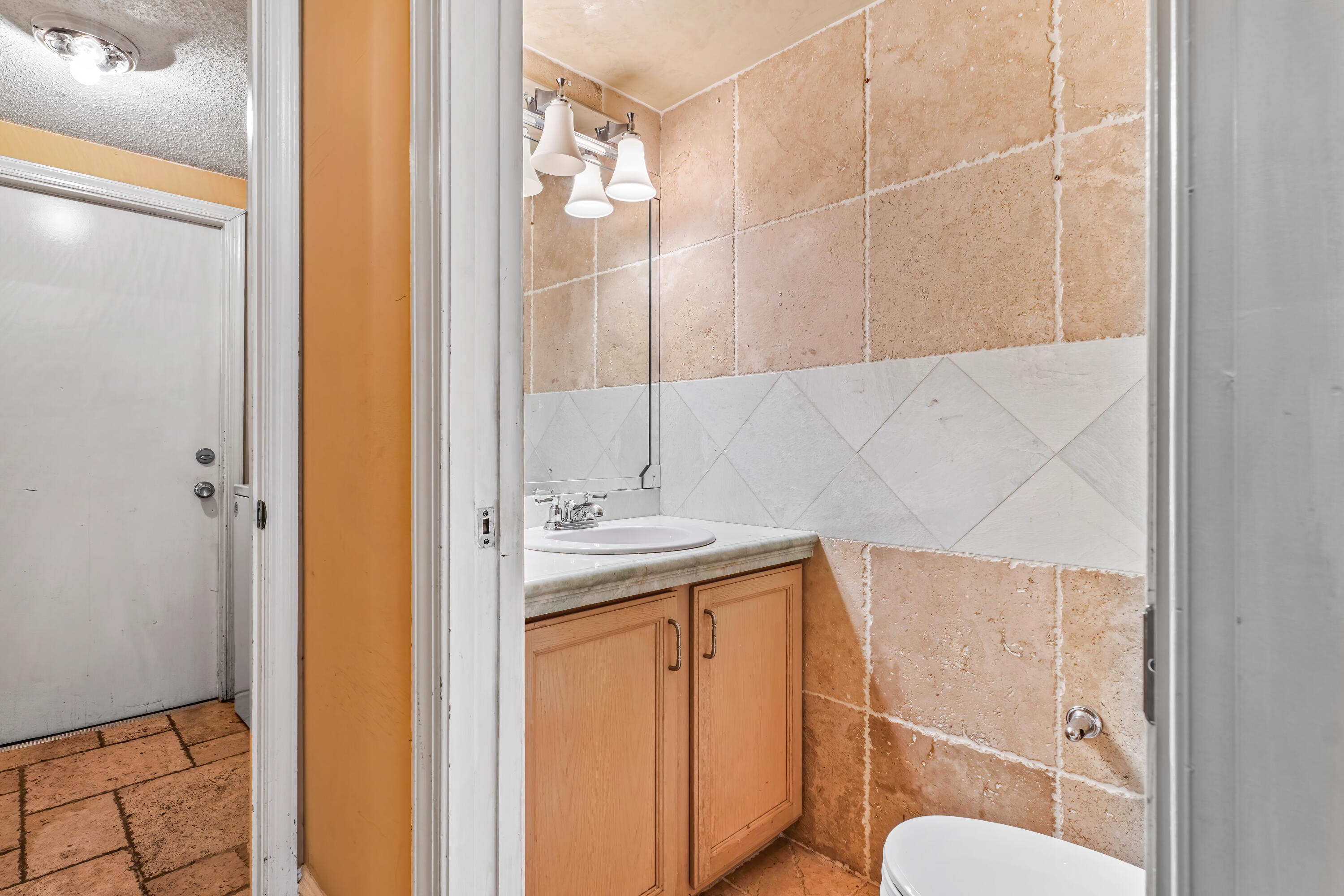 2224 Soundings Court Greenacres, FL 33413 - Photo 12 of 46 a bathroom with a sink a toilet and shower