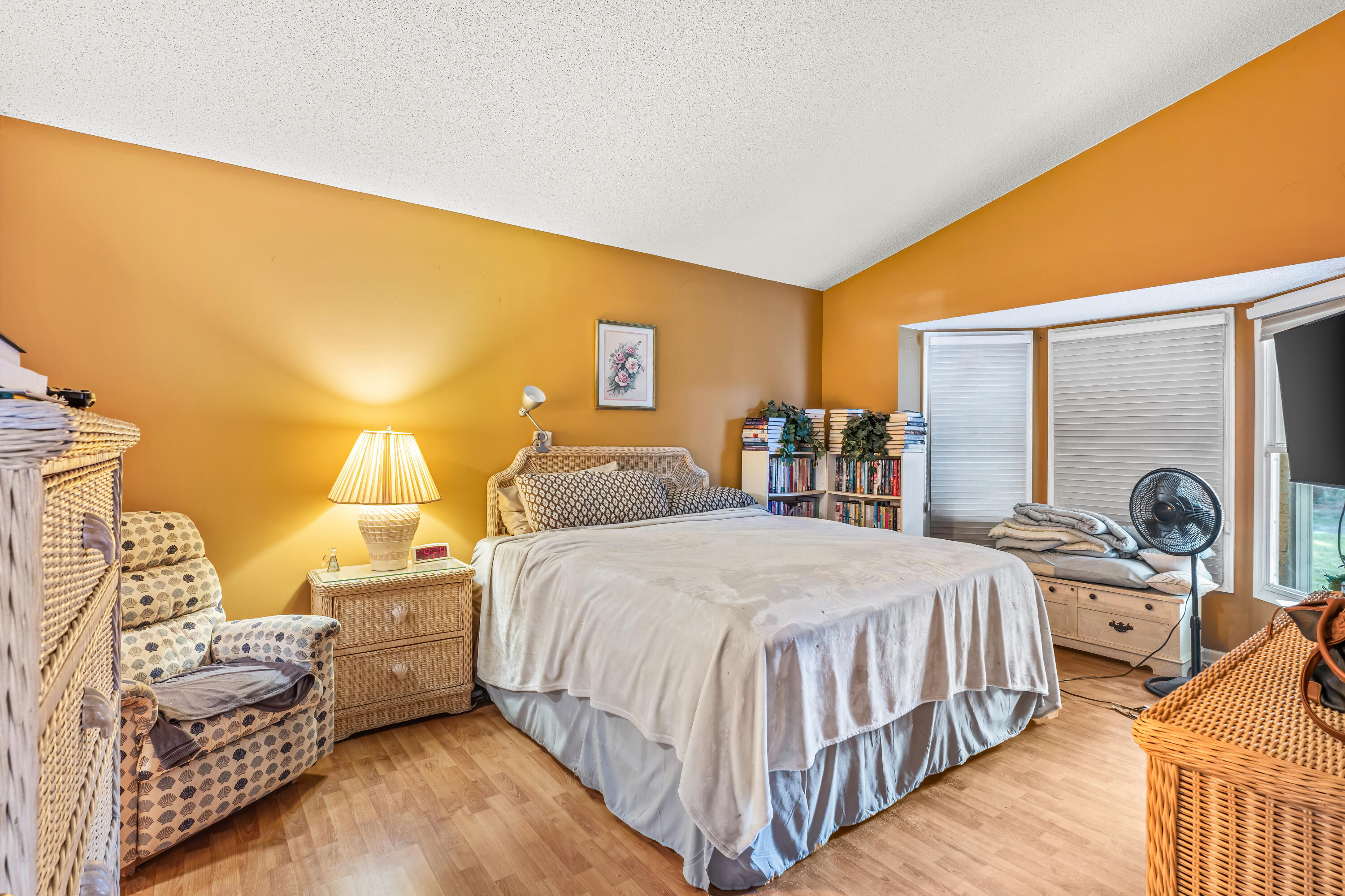 2224 Soundings Court Greenacres, FL 33413 - Photo 19 of 46 a bedroom with a bed and dresser with mirror