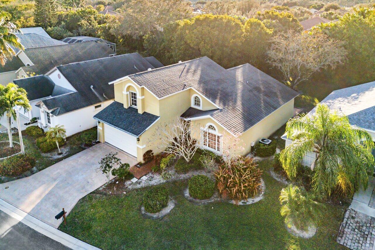 2224 Soundings Court Greenacres, FL 33413 - Photo 30 of 46 an aerial view of a house with garden space and lake view