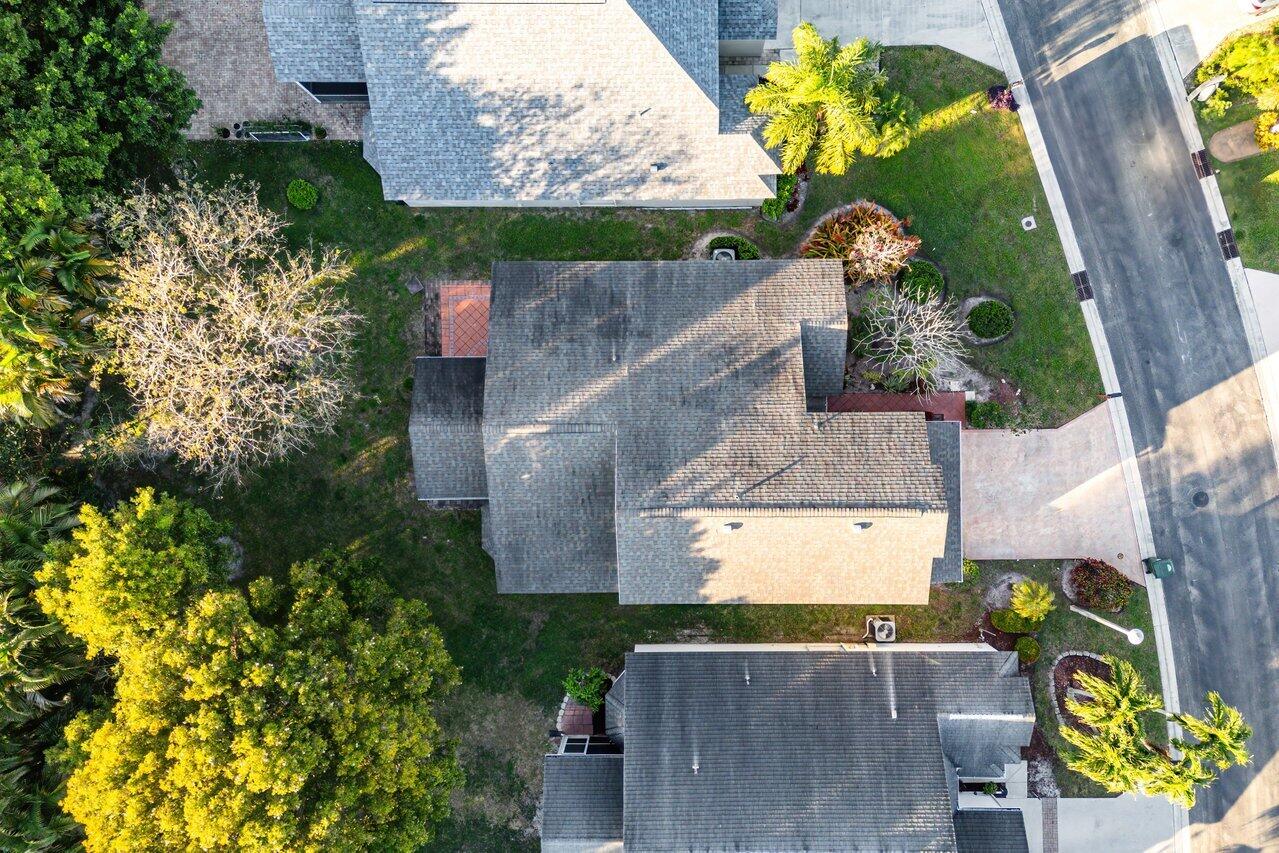 2224 Soundings Court Greenacres, FL 33413 - Photo 32 of 46 an aerial view of a house with a yard