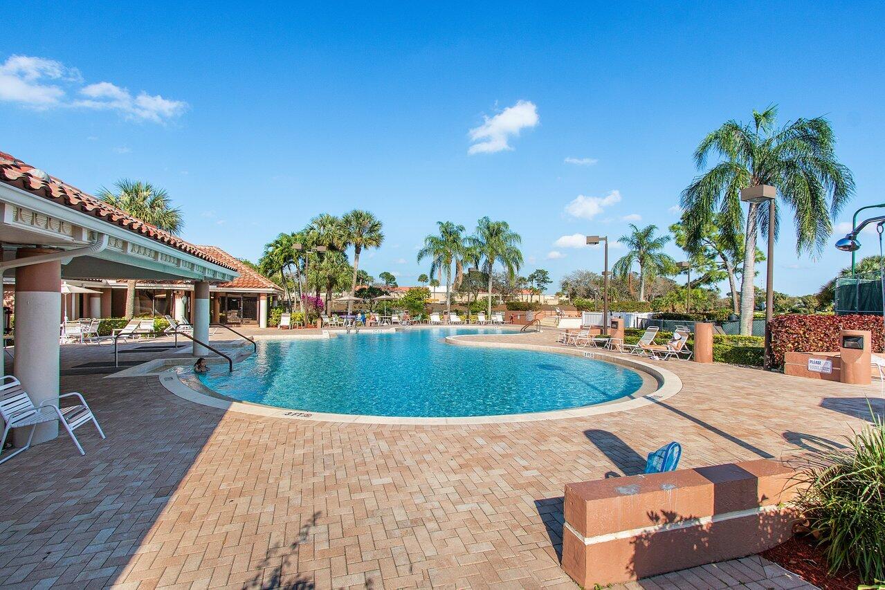 2224 Soundings Court Greenacres, FL 33413 - Photo 44 of 46 a view of a swimming pool with a patio