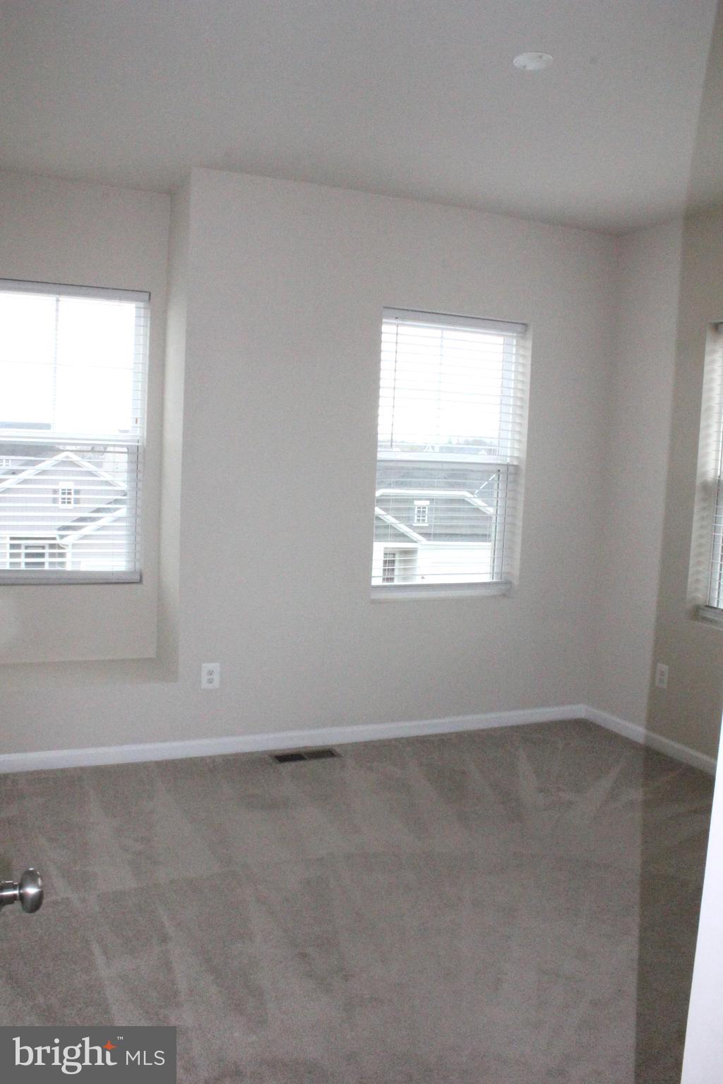232 Parkland Drive Stephenson, VA 22656 - Photo 15 of 18 an empty room with windows