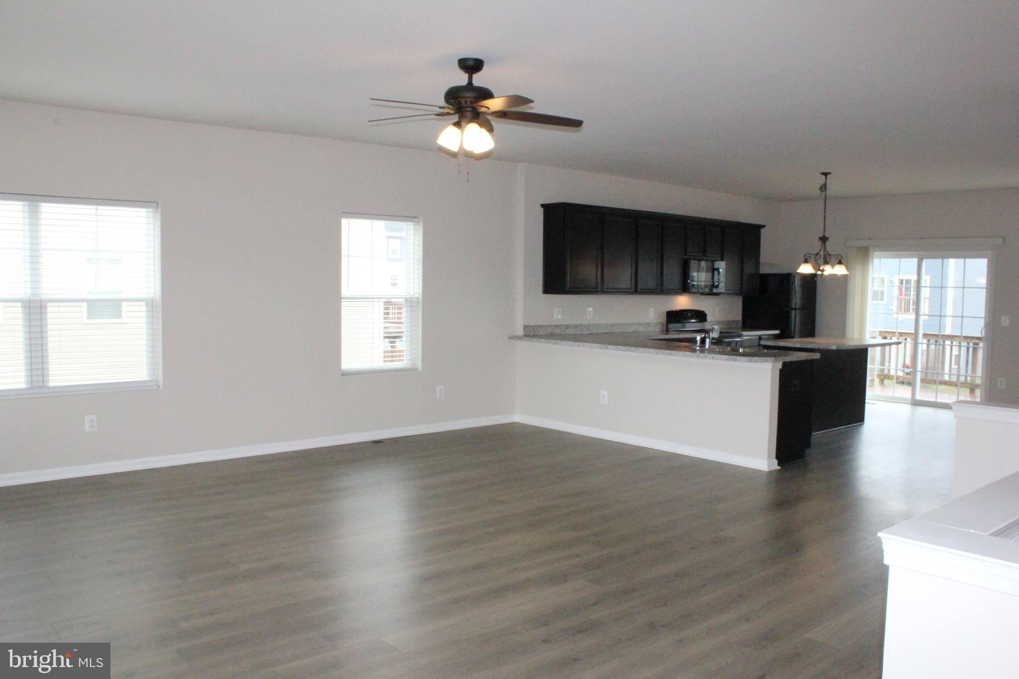 232 Parkland Drive Stephenson, VA 22656 - Photo 2 of 18 a view of kitchen with cabinets stove and wooden floor