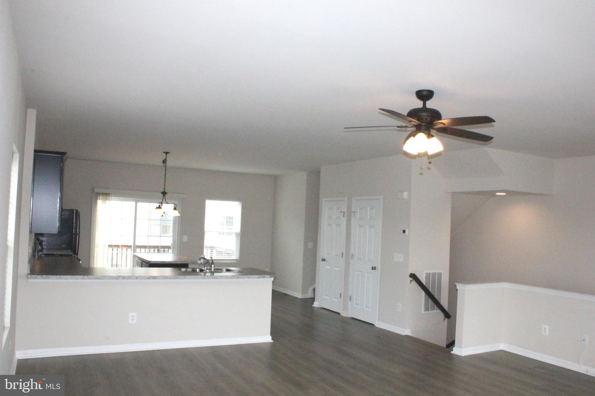 232 Parkland Drive Stephenson, VA 22656 - Photo 3 of 18 a view of a kitchen with a sink stainless steel appliances and cabinets