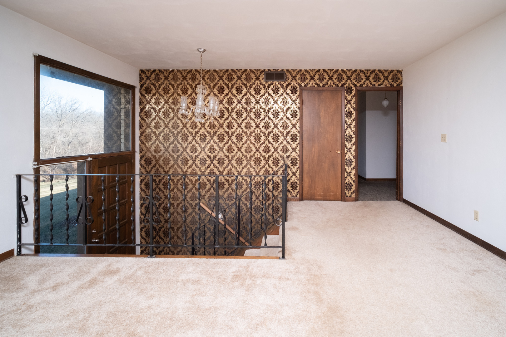 5221 Rotary Road Cherry Valley, IL 61016 - Photo 5 of 35 an empty room with wall painting and a window