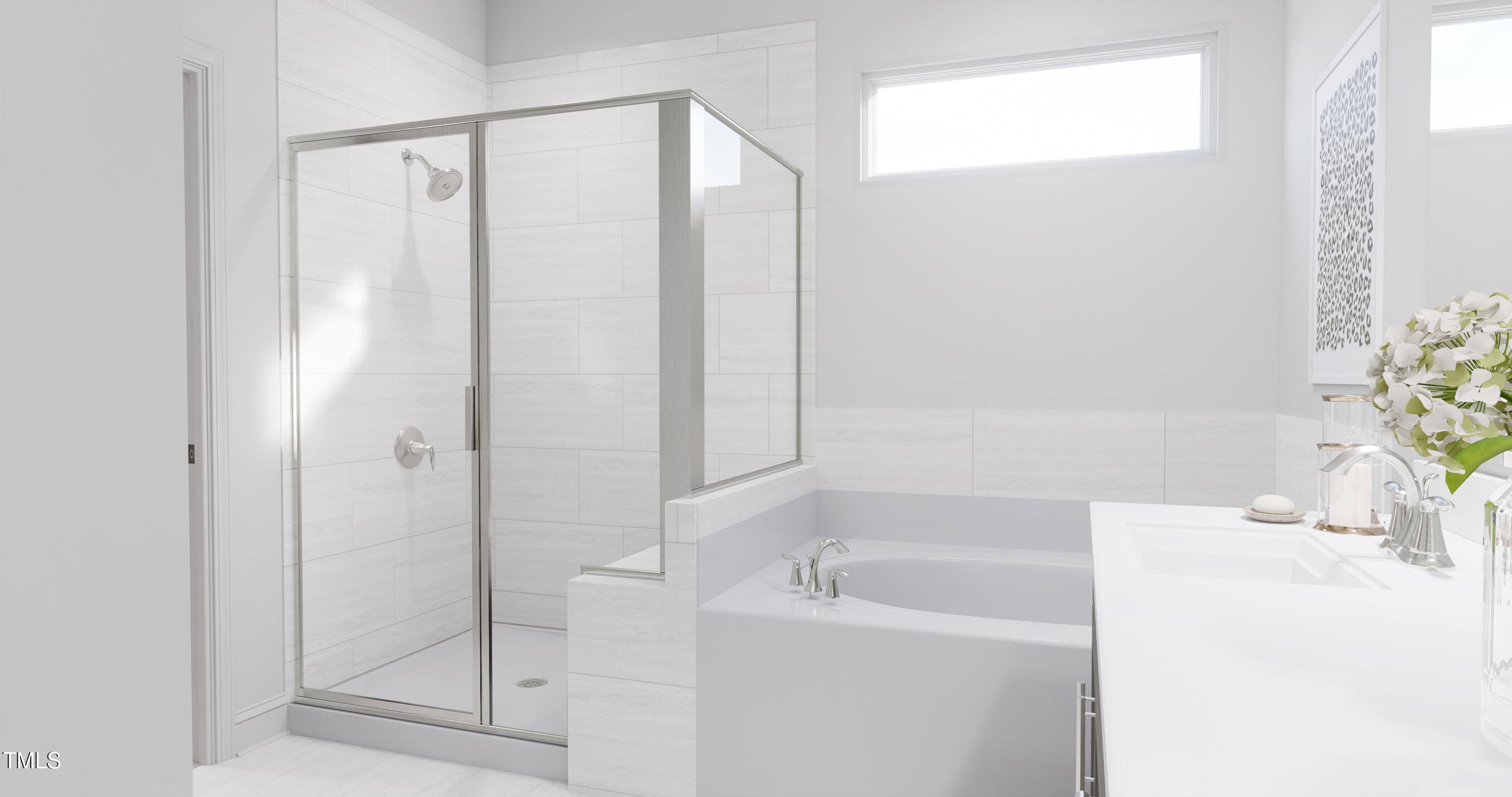 353 Calvander Lane Apex, NC 27539 - Photo 12 of 33 a bathroom with a bathtub a sink and a shower