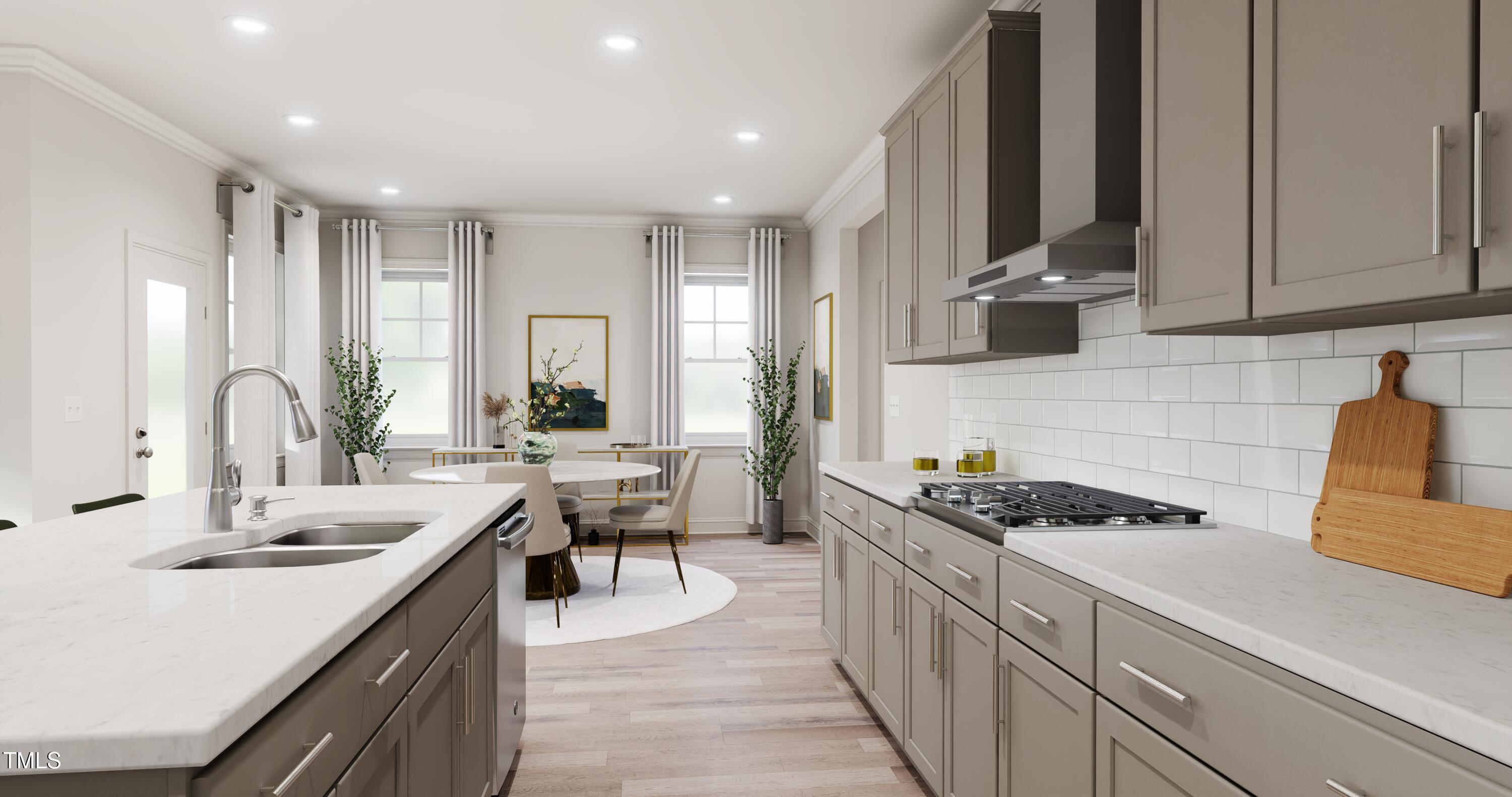 353 Calvander Lane Apex, NC 27539 - Photo 3 of 33 a kitchen with sink stove and cabinets