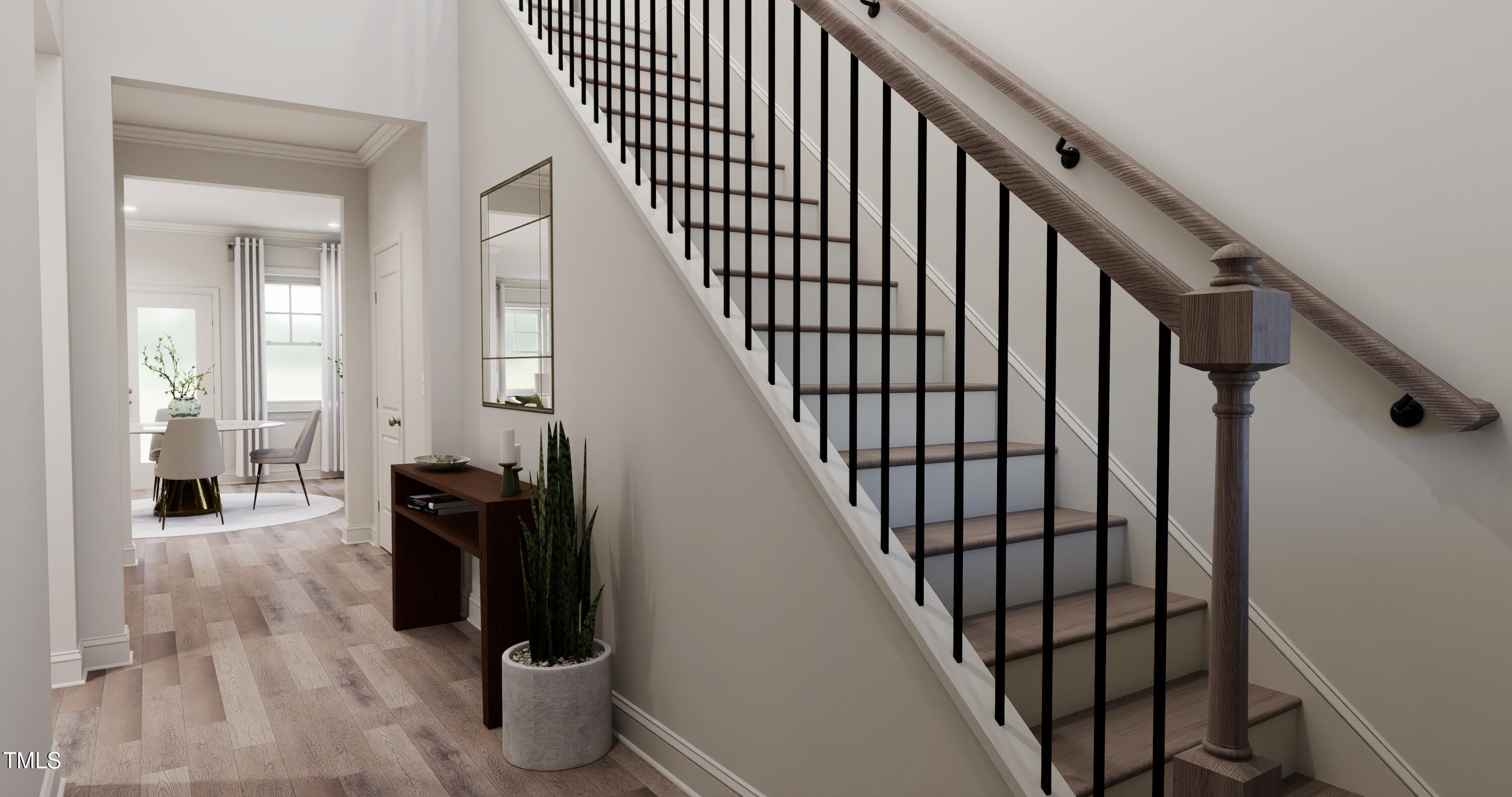 353 Calvander Lane Apex, NC 27539 - Photo 8 of 33 a view of entryway and hall with wooden floor