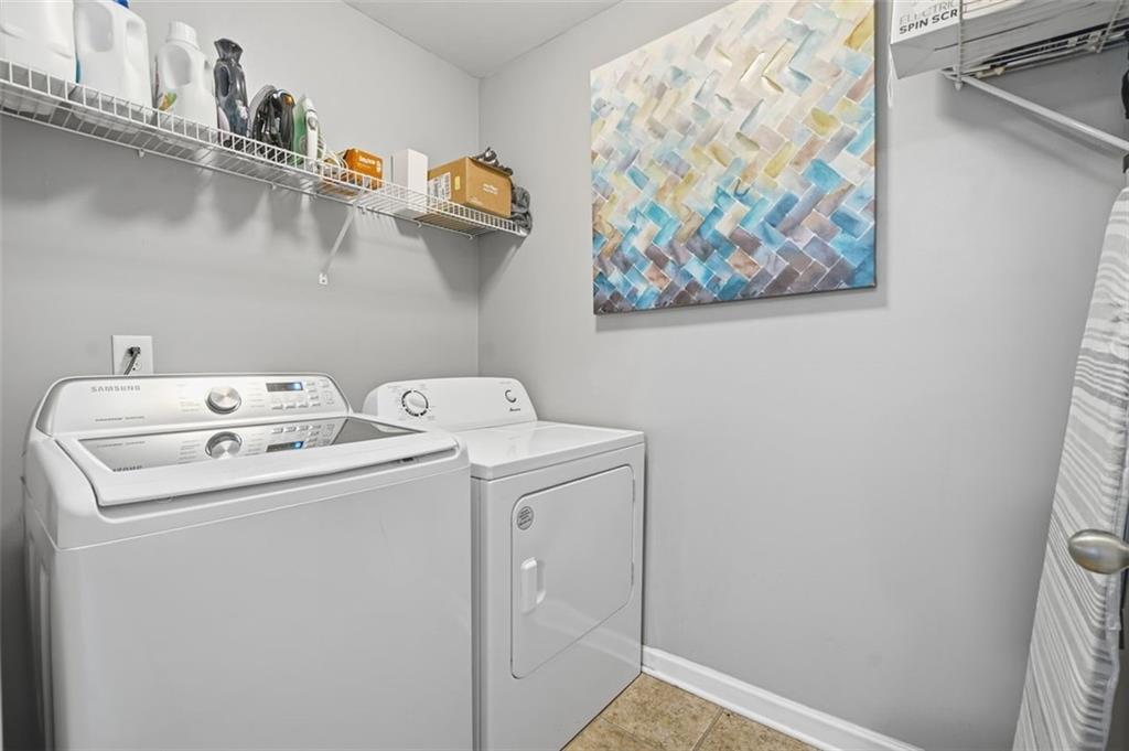 2234 Sawgrass Drive Hampton, GA 30228 - Photo 13 of 28 a utility room with dryer and washer