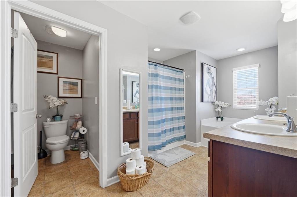 2234 Sawgrass Drive Hampton, GA 30228 - Photo 16 of 28 a bathroom with a sink and a mirror