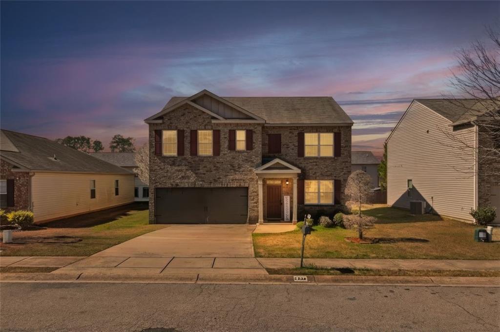 2234 Sawgrass Drive Hampton, GA 30228 - Photo 2 of 28 a front view of a house with entertaining space