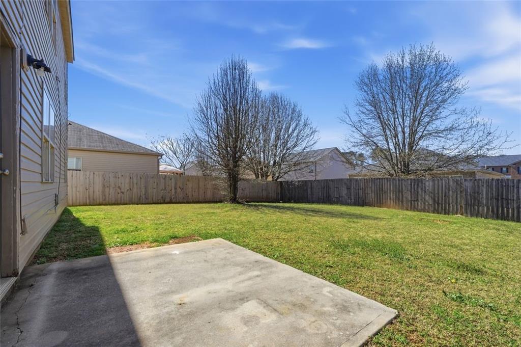 2234 Sawgrass Drive Hampton, GA 30228 - Photo 25 of 28 a view of a backyard with green space