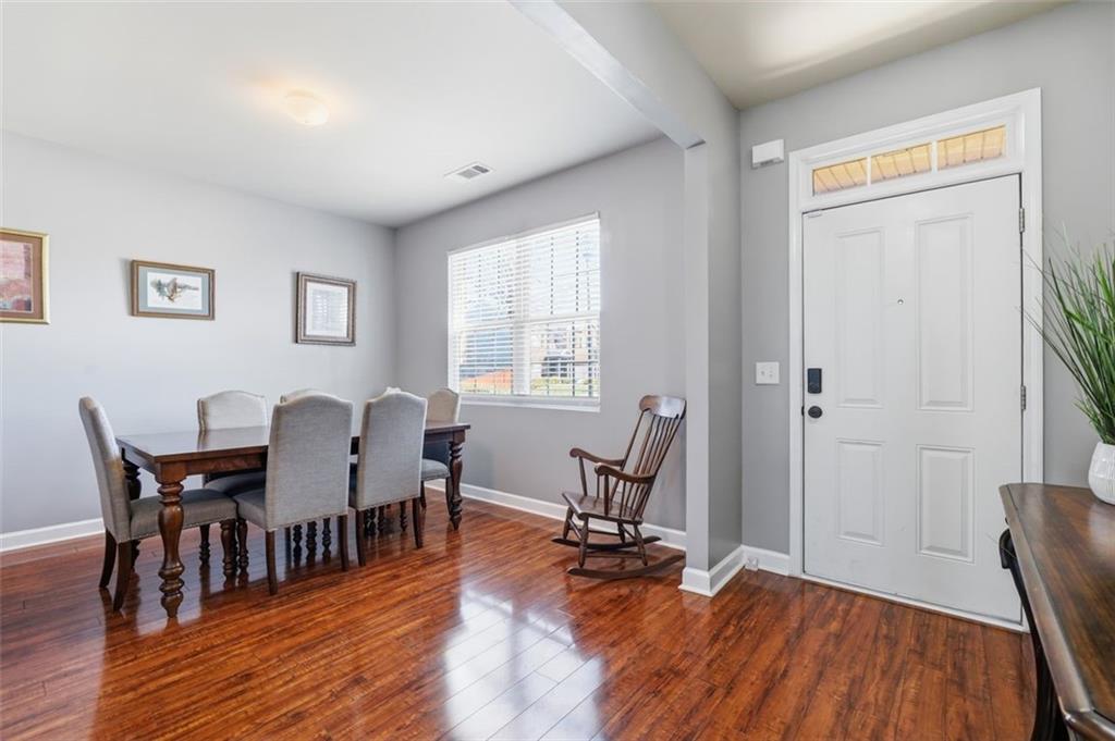 2234 Sawgrass Drive Hampton, GA 30228 - Photo 3 of 28 a view of a dining room with furniture and wooden floor