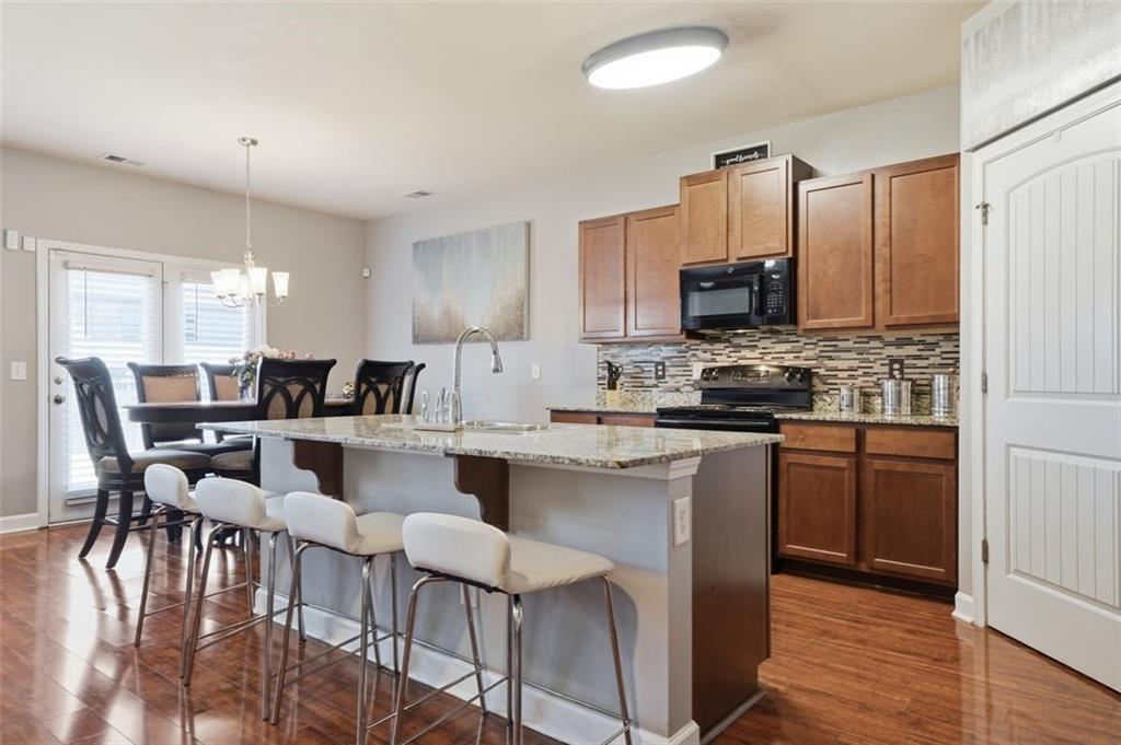 2234 Sawgrass Drive Hampton, GA 30228 - Photo 5 of 28 a large white kitchen with lots of counter top space and stainless steel appliances