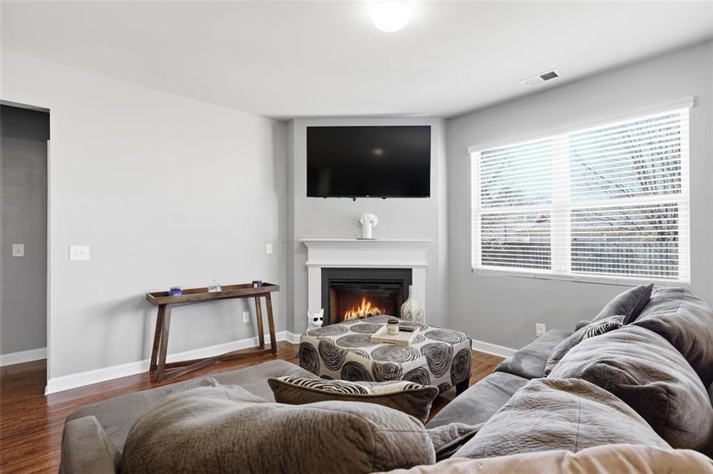 2234 Sawgrass Drive Hampton, GA 30228 - Photo 10 of 28 a living room with furniture and a fireplace