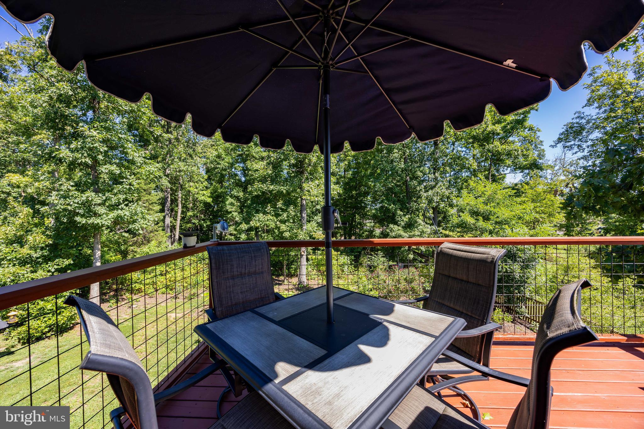 197 Catch Release Court Inwood, WV 25428 - Photo 20 of 53 Overlooks the lush, treed back yard