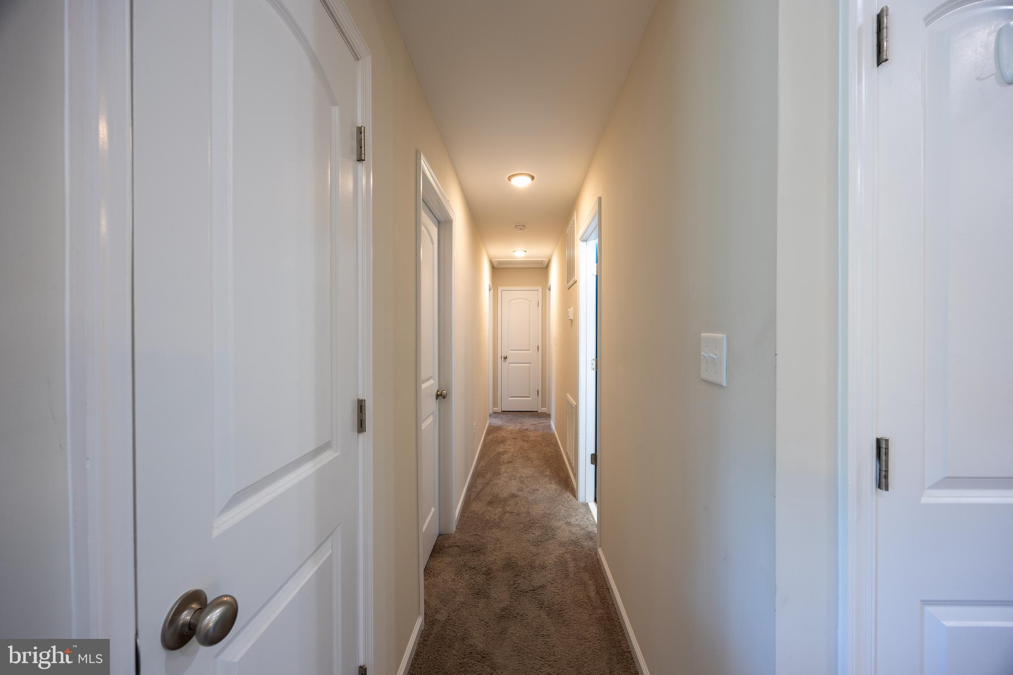 197 Catch Release Court Inwood, WV 25428 - Photo 25 of 53 Hallway to bedrooms offers privacy