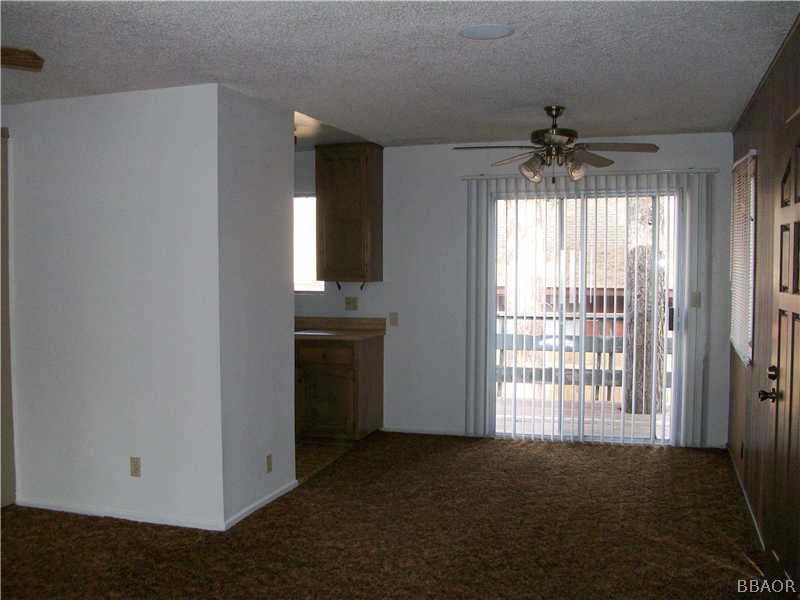 402 Riverside Sugarloaf, CA 92386 - Photo 12 of 18 a view of an empty room with a window