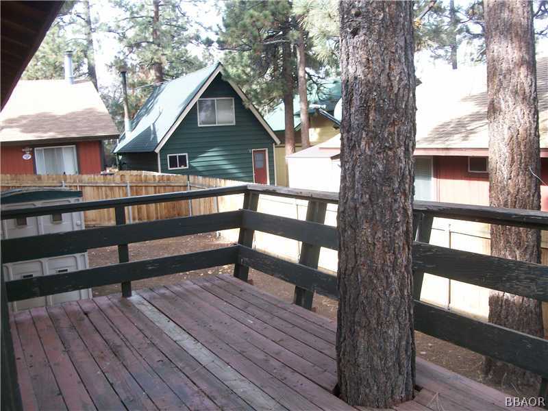 402 Riverside Sugarloaf, CA 92386 - Photo 13 of 18 a view of house with a yard and wooden floor