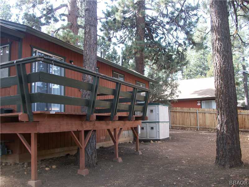 402 Riverside Sugarloaf, CA 92386 - Photo 16 of 18 a view of backyard with deck and outdoor seating