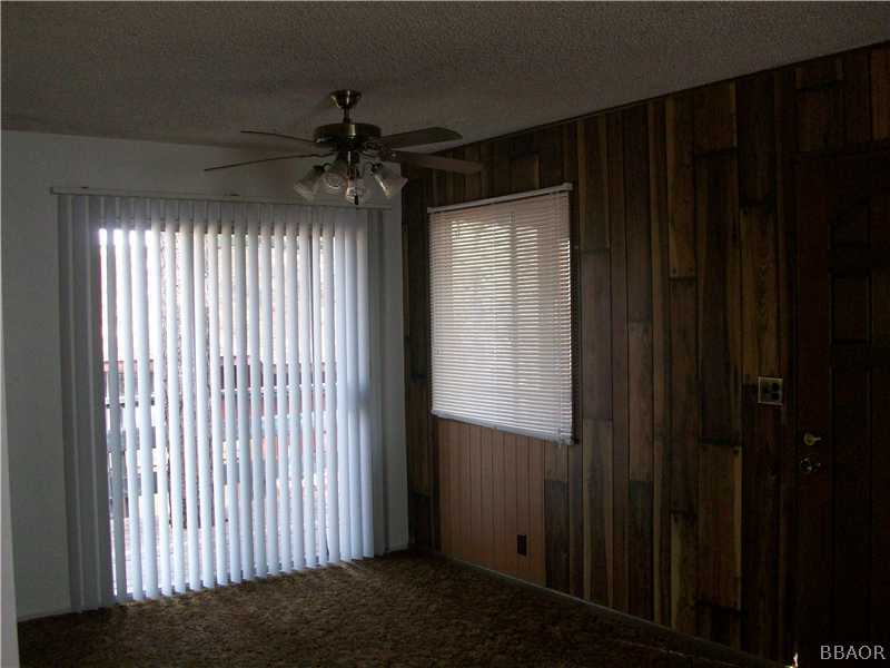 402 Riverside Sugarloaf, CA 92386 - Photo 6 of 18 a view of empty room with a window