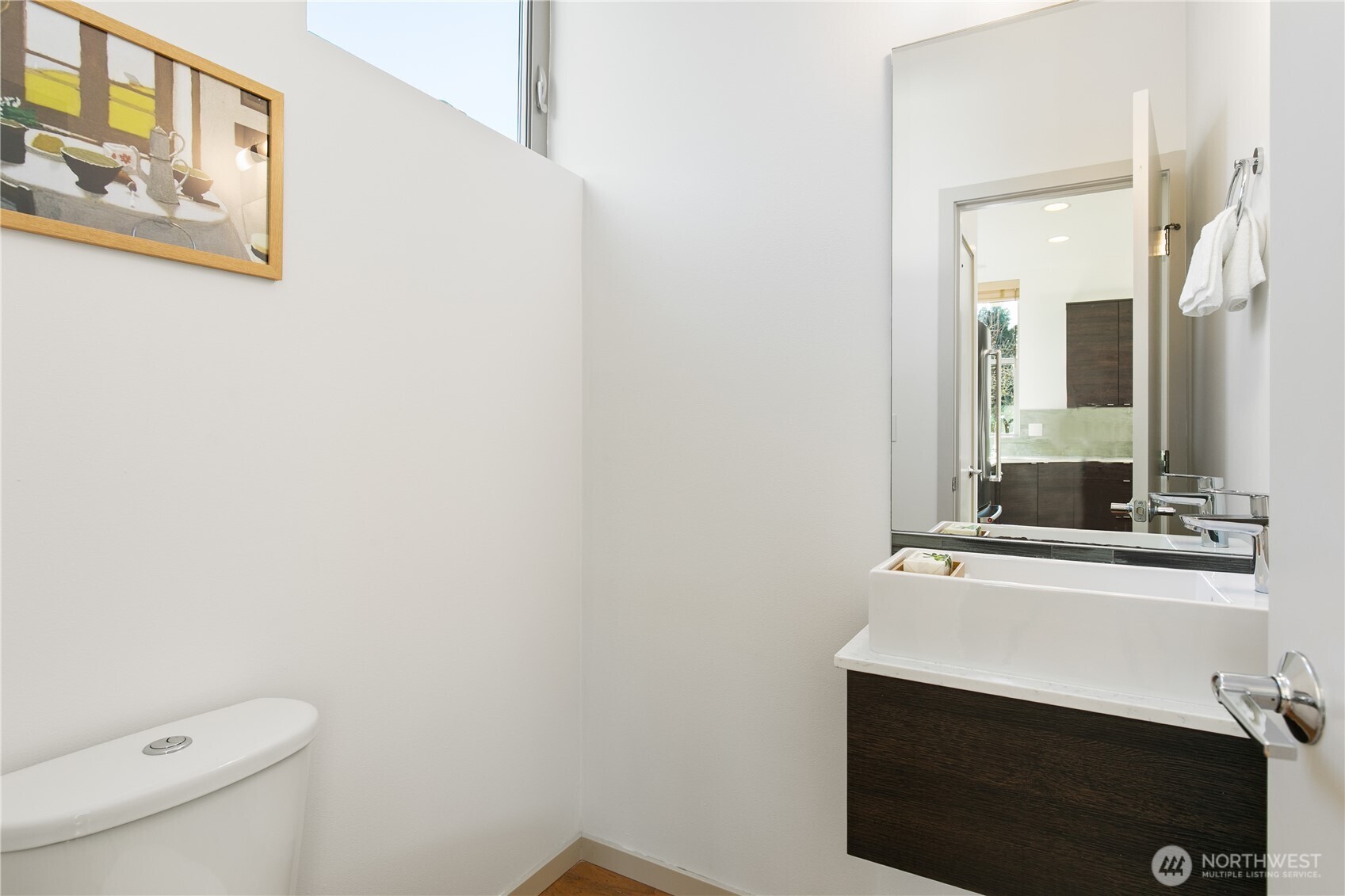 6729 14th Avenue Northwest, Unit B Seattle, WA 98117 - Photo 11 of 36 a bathroom with a sink and a mirror