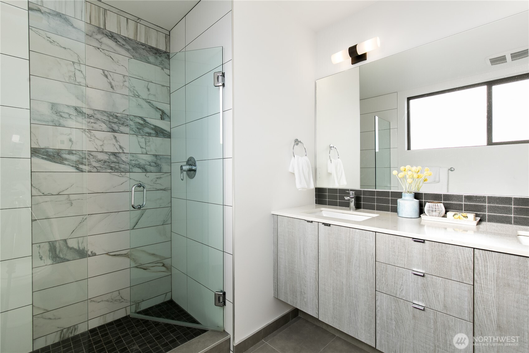 6729 14th Avenue Northwest, Unit B Seattle, WA 98117 - Photo 15 of 36 a bathroom with a double sink shower and a mirror