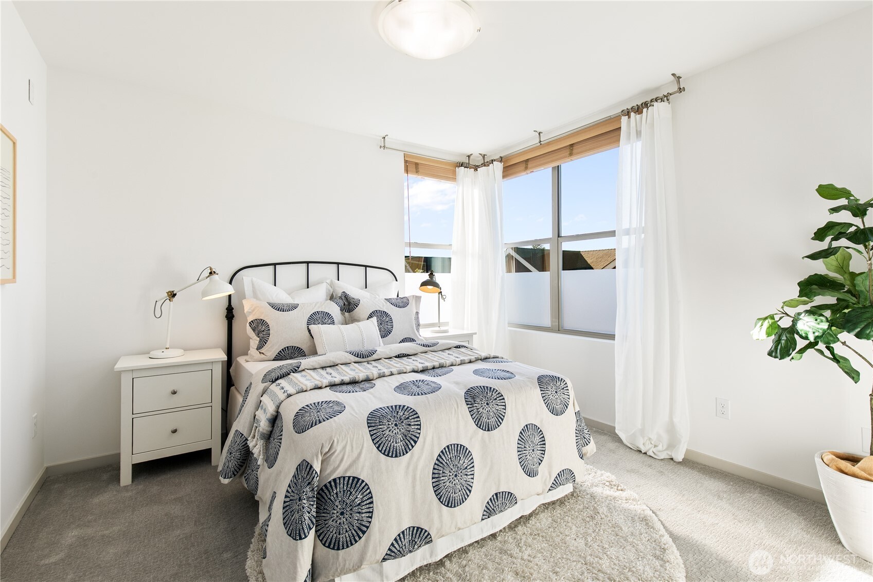 6729 14th Avenue Northwest, Unit B Seattle, WA 98117 - Photo 17 of 36 a bedroom with a bed and a window