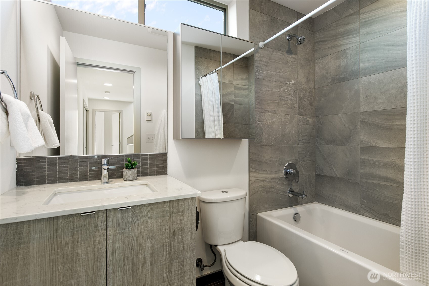 6729 14th Avenue Northwest, Unit B Seattle, WA 98117 - Photo 19 of 36 a bathroom with a sink a toilet and bathtub