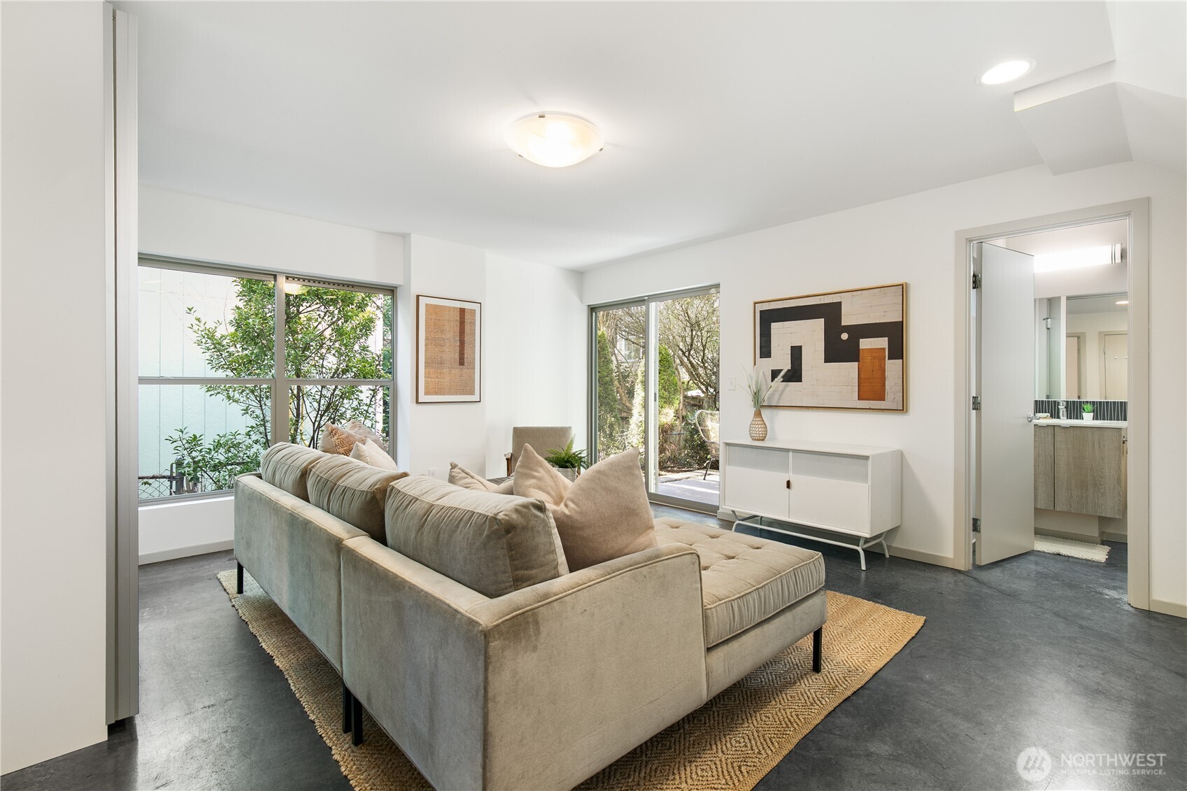 6729 14th Avenue Northwest, Unit B Seattle, WA 98117 - Photo 21 of 36 a living room with furniture and a large window
