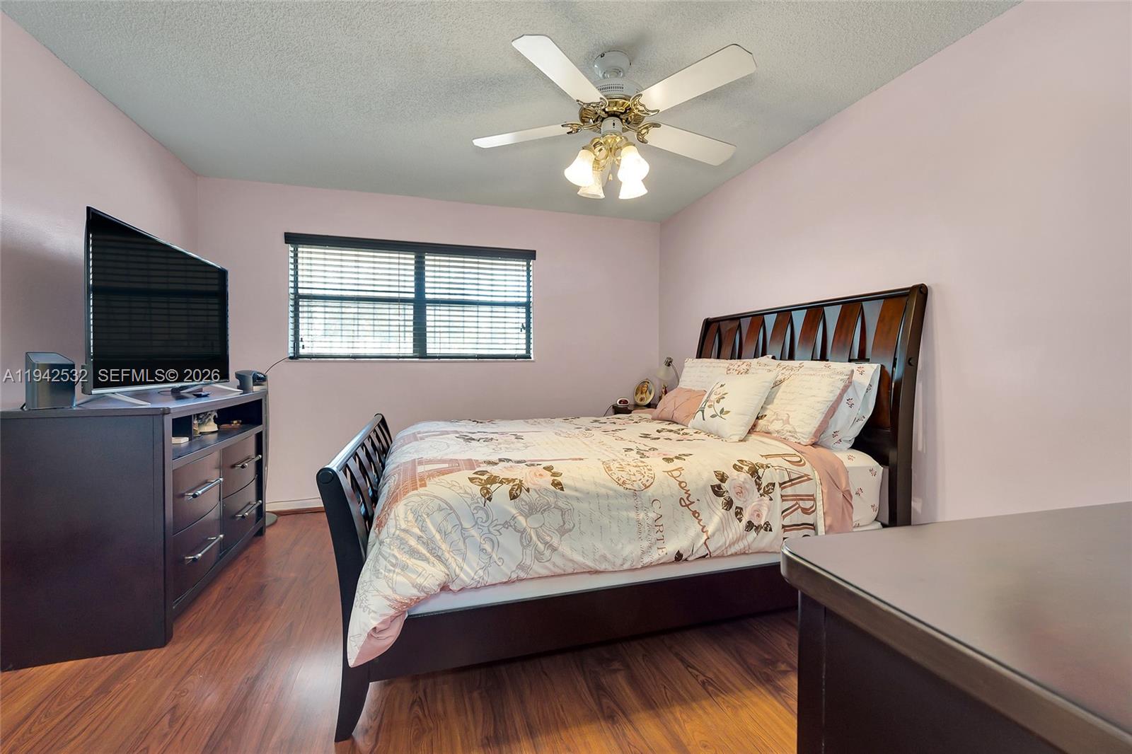12960 Southwest 66th Lane, Unit 1081 Miami, FL 33183 - Photo 11 of 20 a bedroom with a bed and a flat screen tv