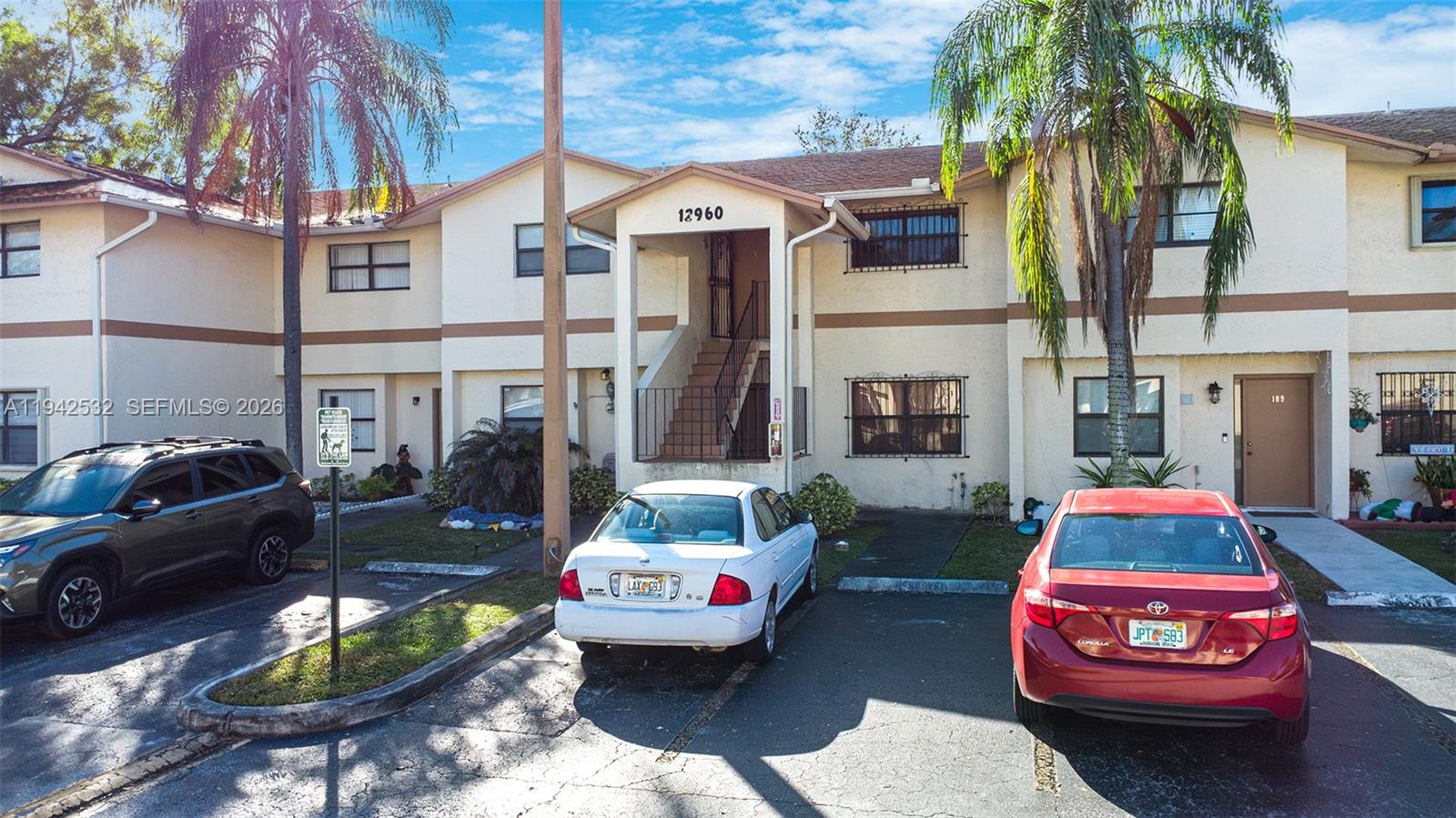 12960 Southwest 66th Lane, Unit 1081 Miami, FL 33183 - Photo 2 of 20 a front view of a house with swimming pool
