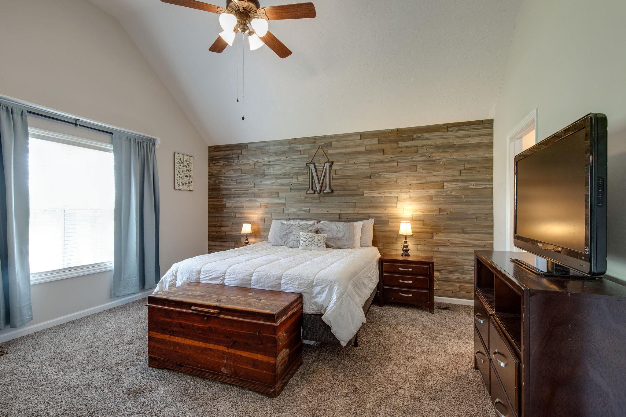 349 Lear Road Portland, TN 37148 - Photo 12 of 24 a bedroom with a bed and a flat tv screen on the dresser