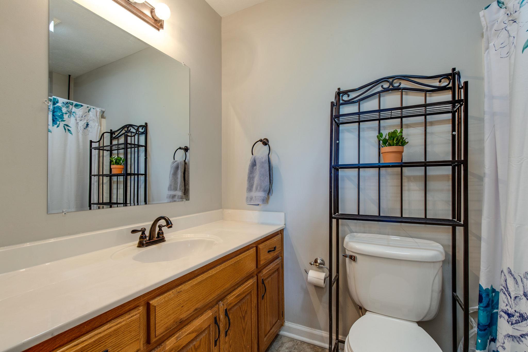 349 Lear Road Portland, TN 37148 - Photo 14 of 24 a bathroom with a toilet sink and mirror