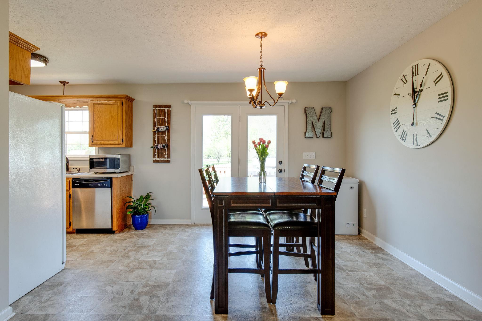 349 Lear Road Portland, TN 37148 - Photo 8 of 24 a view of a dining room with furniture window and wooden floor