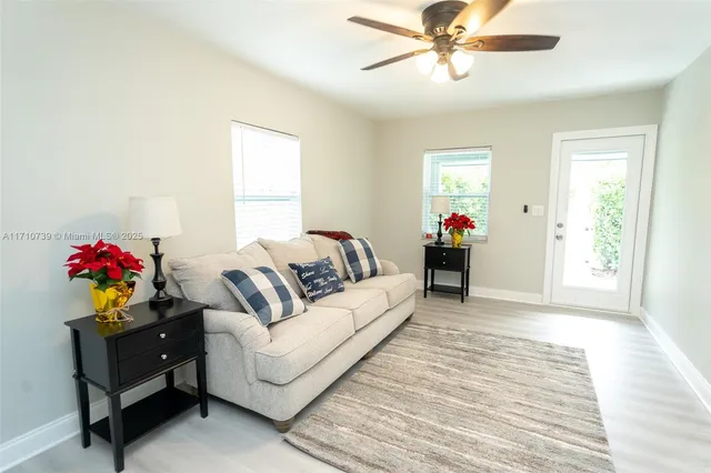 a kitchen with stainless steel appliances a refrigerator sink and microwave