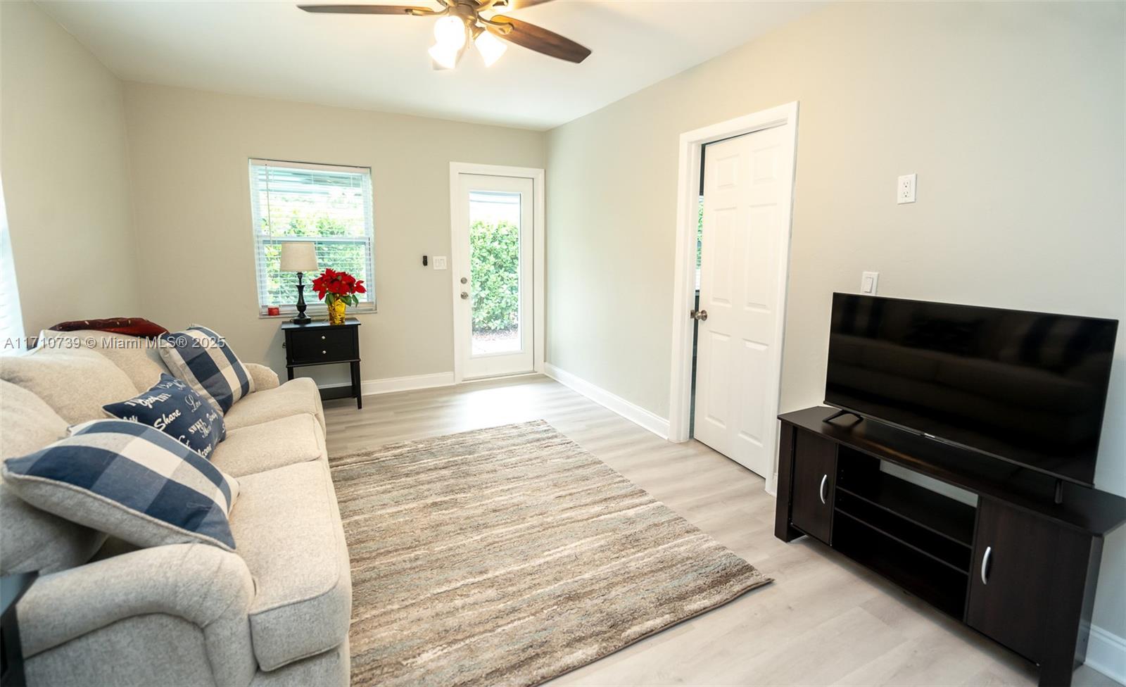2230 Southwest 60th Court Miami, FL 33155 - Photo 13 of 64 a bedroom with furniture and a flat screen tv