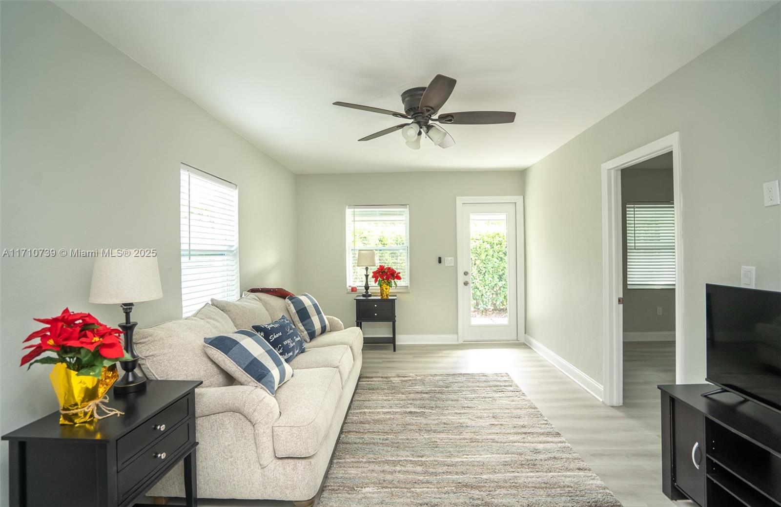 2230 Southwest 60th Court Miami, FL 33155 - Photo 14 of 64 a living room with furniture and a flat screen tv
