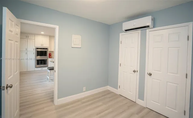 a white toilet sitting next to a white sink