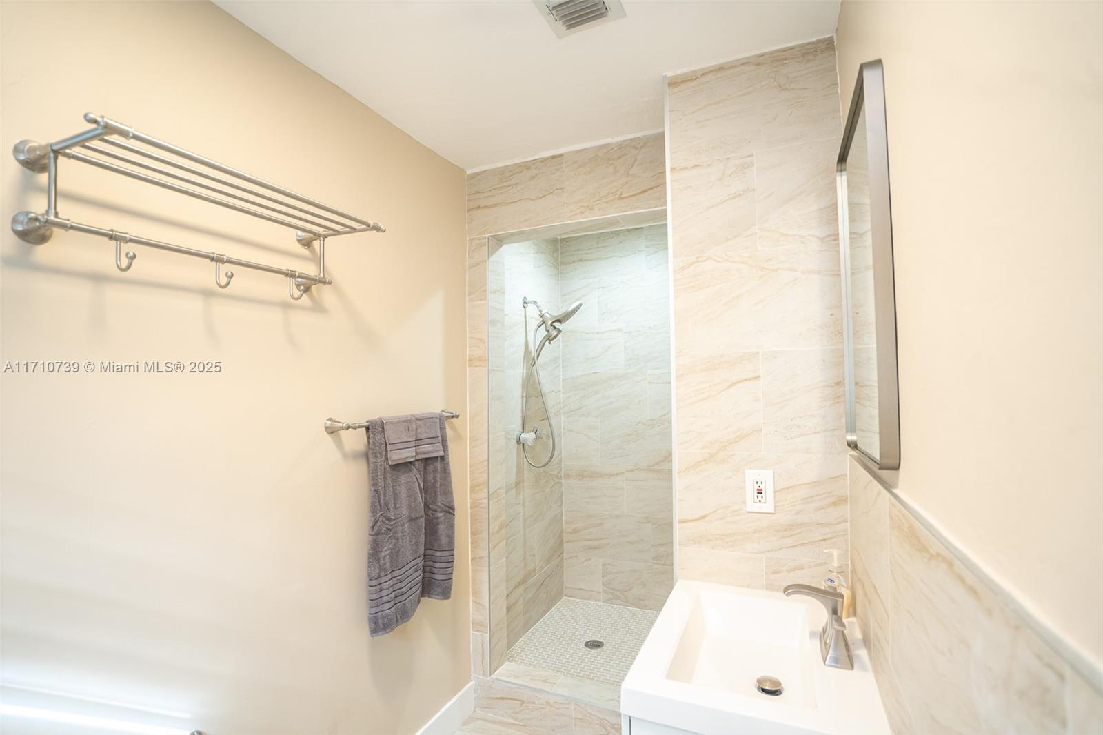 2230 Southwest 60th Court Miami, FL 33155 - Photo 43 of 64 a bathroom with a tub and shower