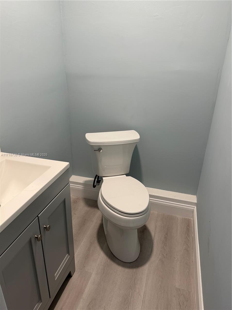 2230 Southwest 60th Court Miami, FL 33155 - Photo 49 of 64 a white toilet sitting next to a white sink