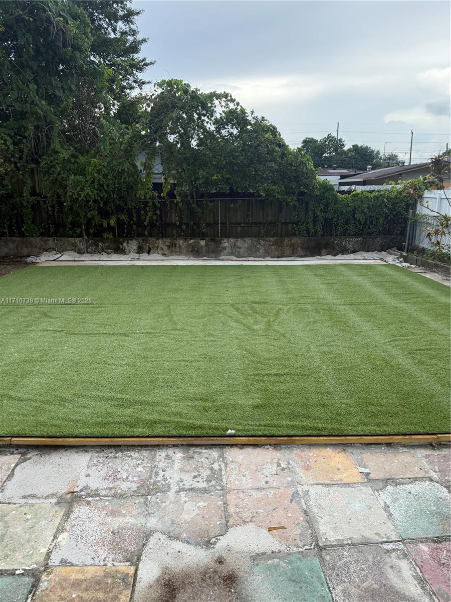 2230 Southwest 60th Court Miami, FL 33155 - Photo 63 of 64 a view of a swimming pool and a yard