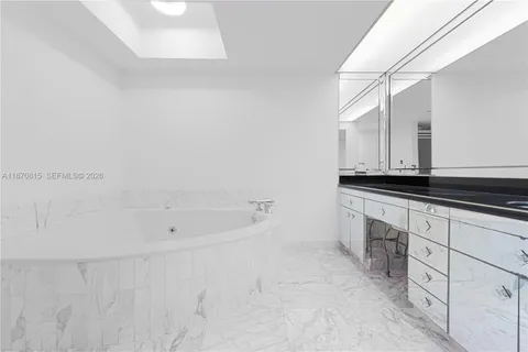 a bathroom with a bathtub and a sink